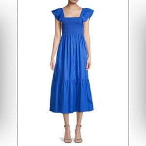 Cotton empire dress, smocked bodice, pockets, square neck, flutter sleeves.